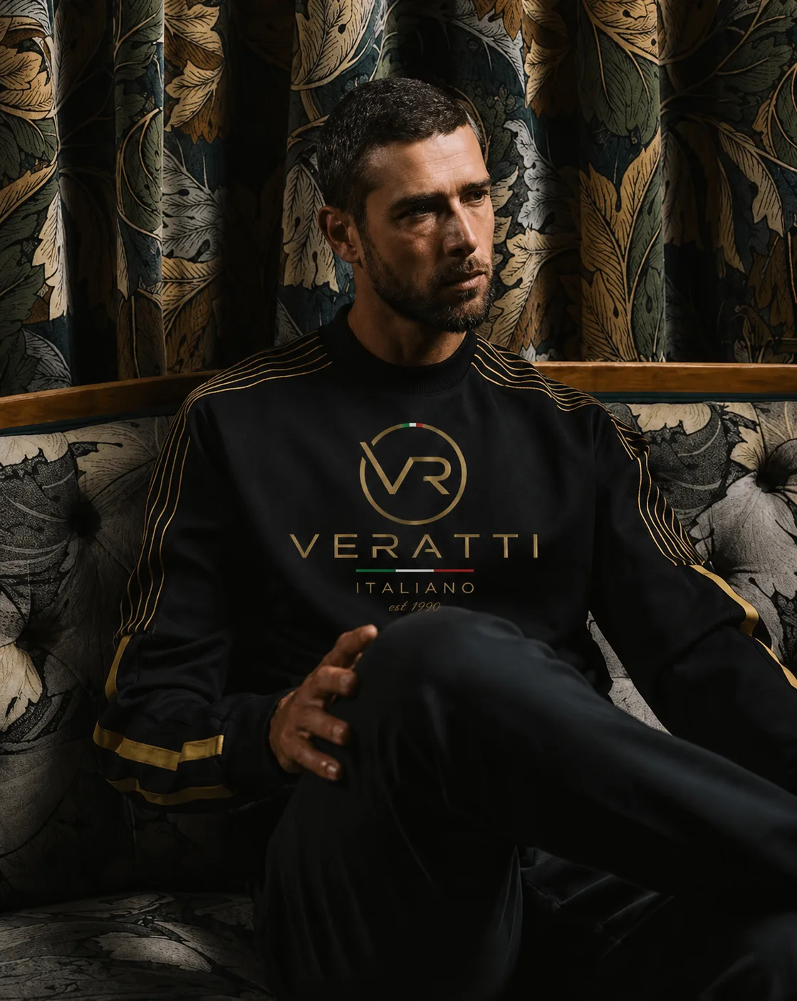 Model in a black and gold VERATTI sweatshirt
